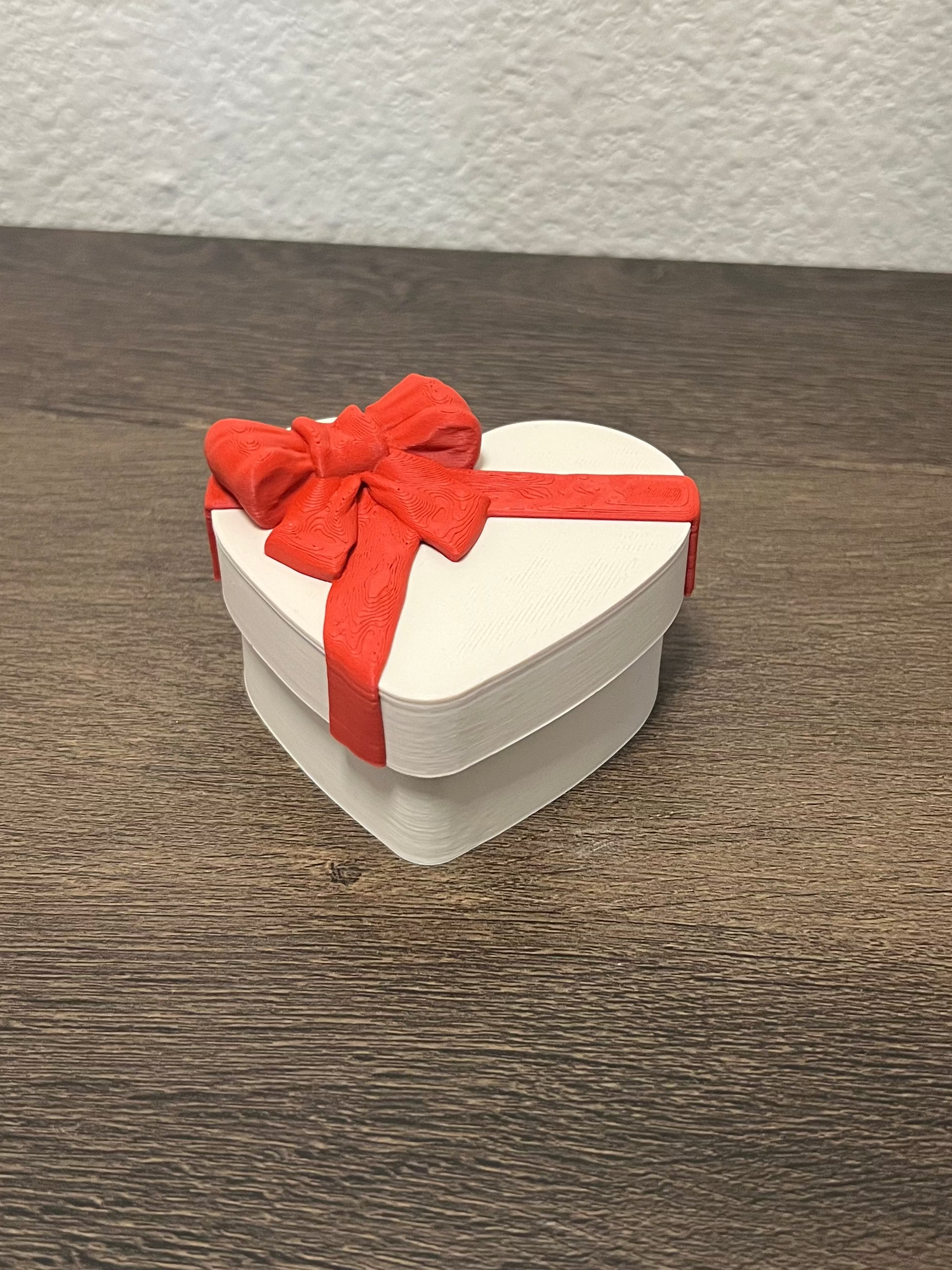 Chocolate clickers in a heart shaped box