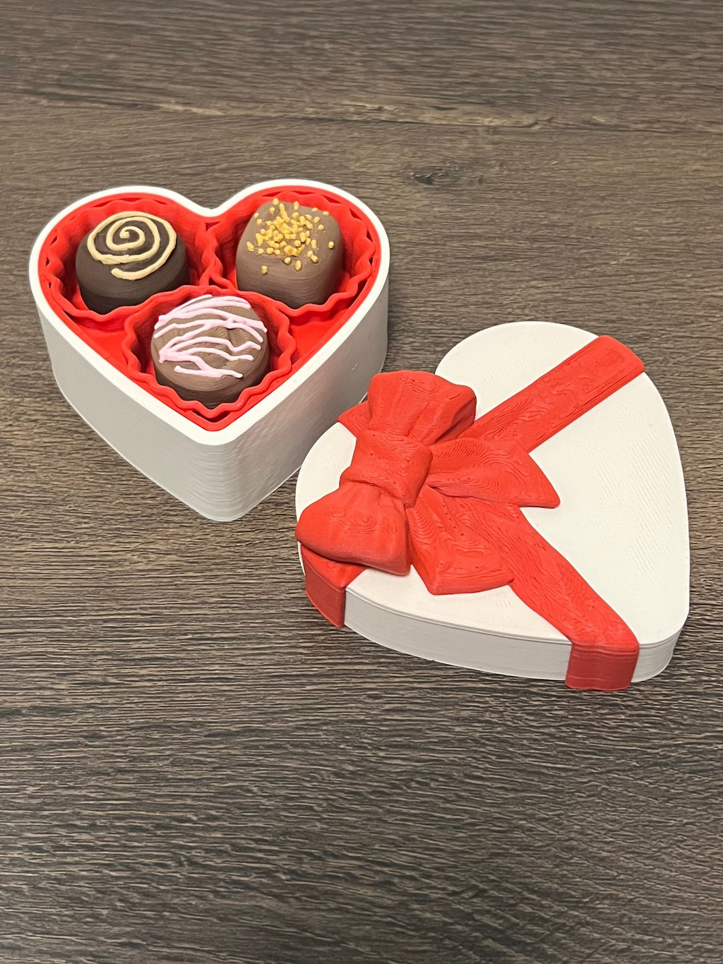 Chocolate clickers in a heart shaped box