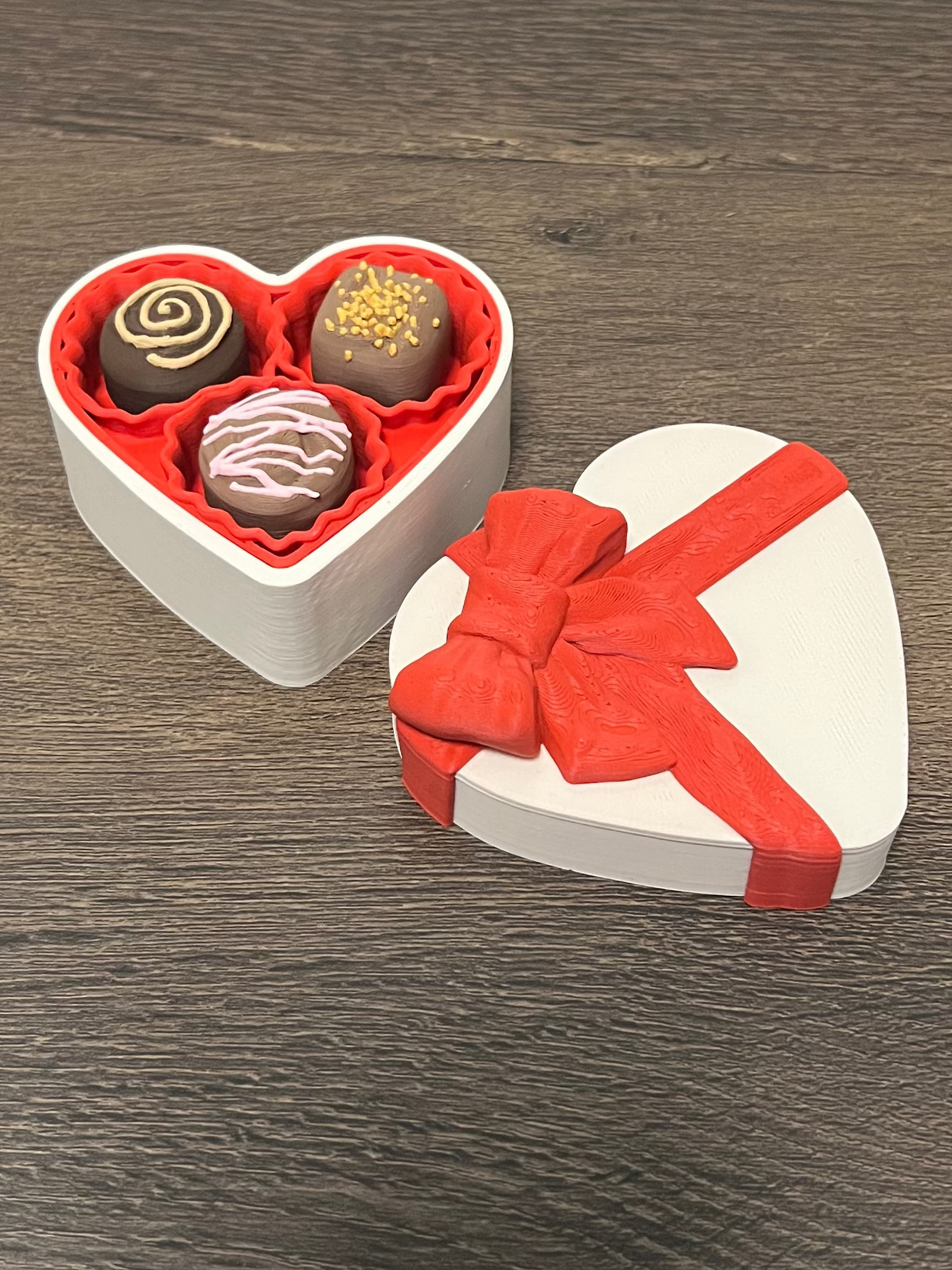 Chocolate clickers in a heart shaped box