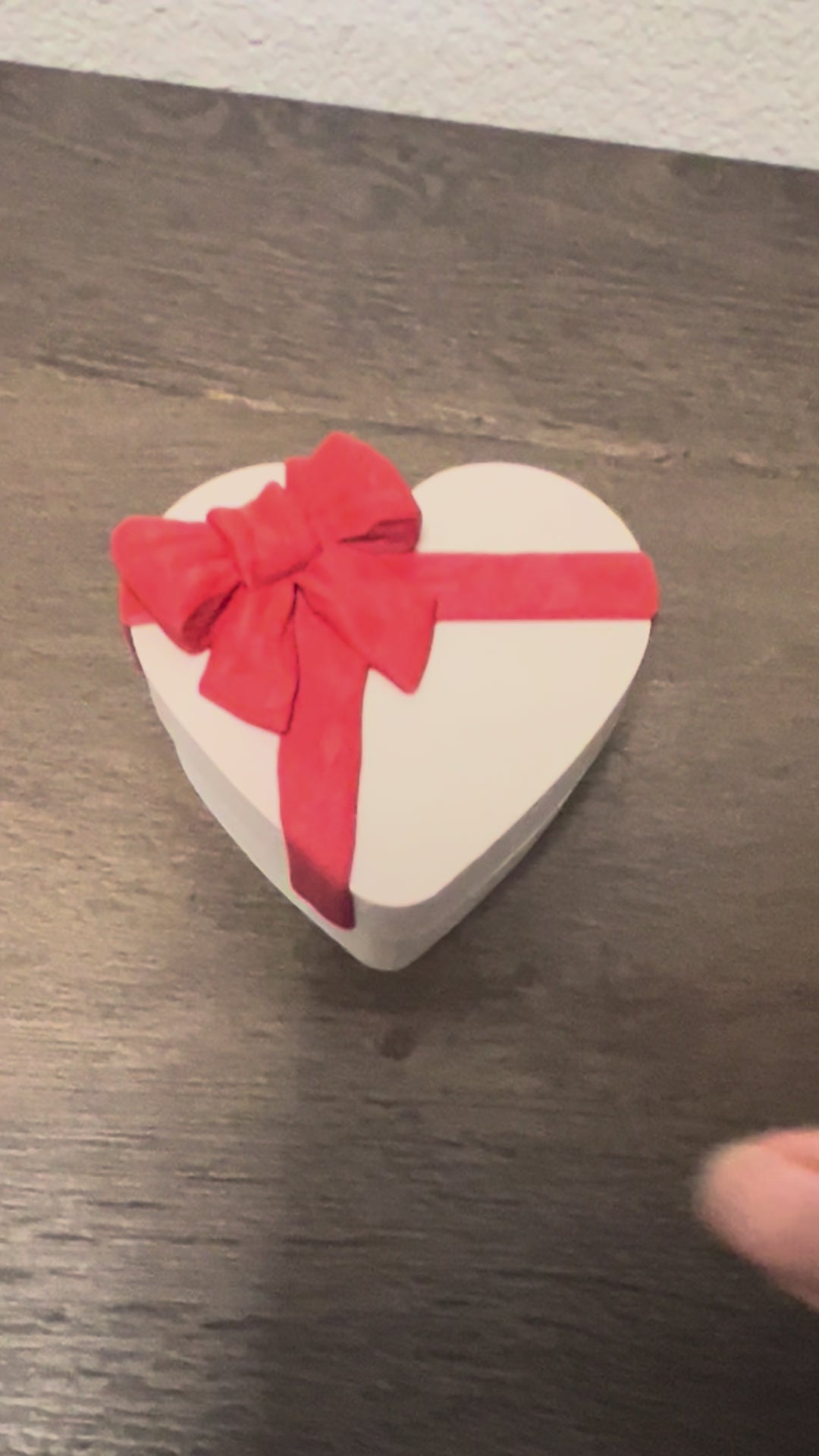 Chocolate clickers in a heart shaped box